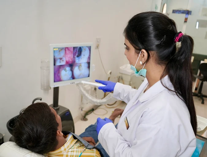 Dr. Sukhpreet Kaur with a patient at Peridot Dental Studio